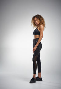 Black sports bra and black leggings