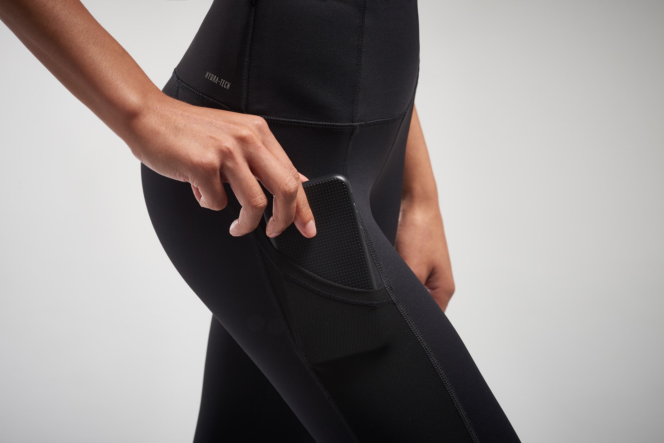 Phone holder on black activewear leggings
