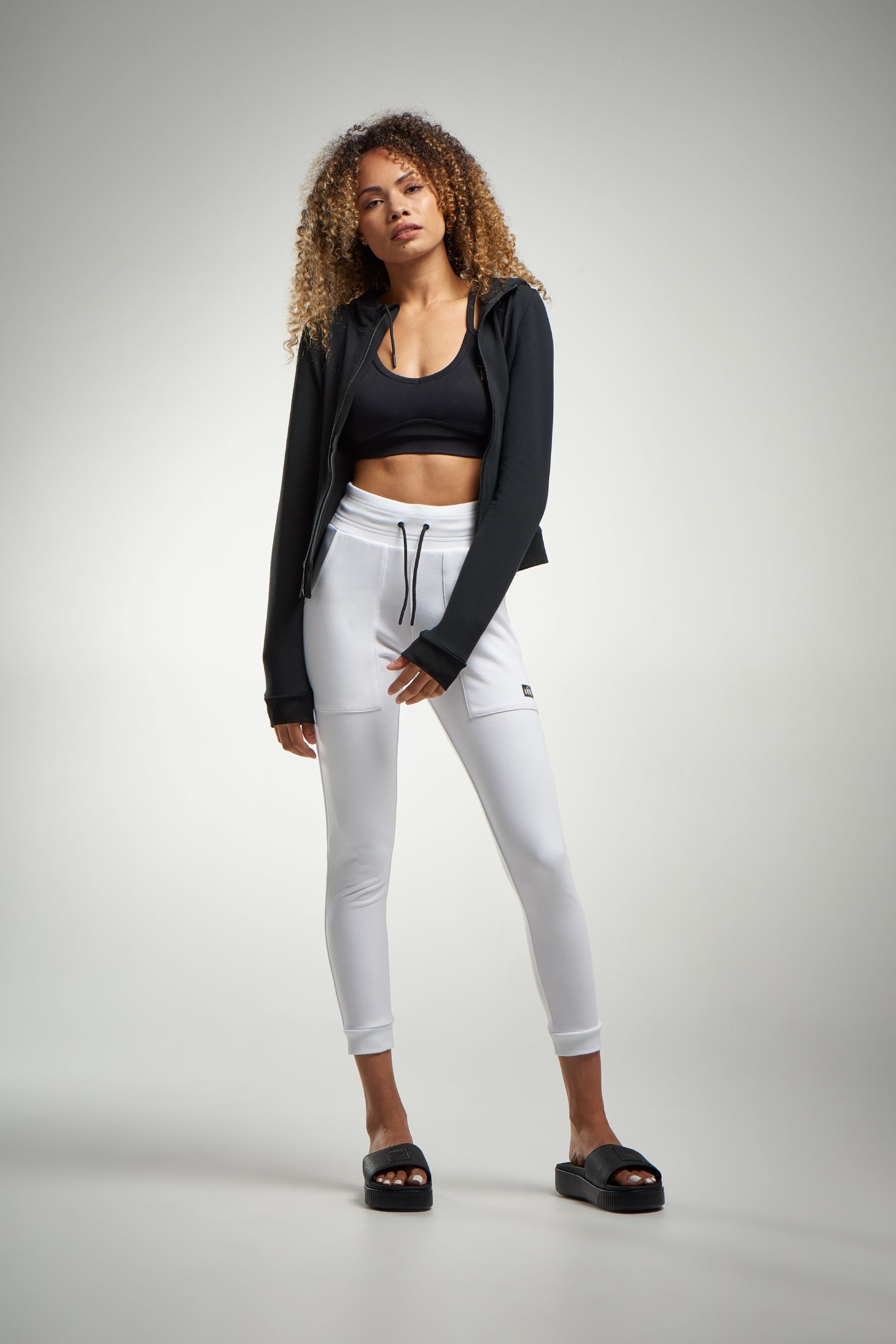 white high waist joggers and sports bra