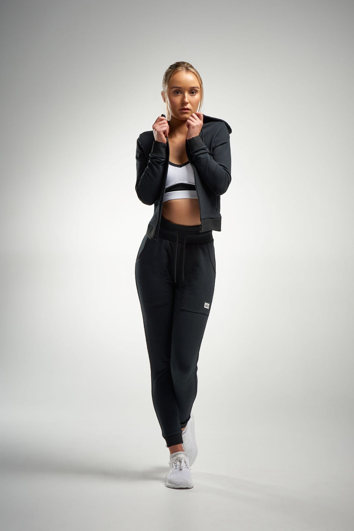 Woman in black cotton track pants