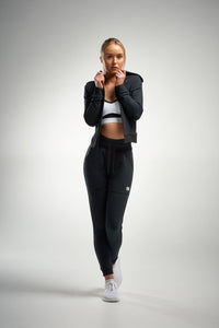 Woman in black cotton track pants