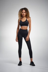 Black sports bra and black leggings