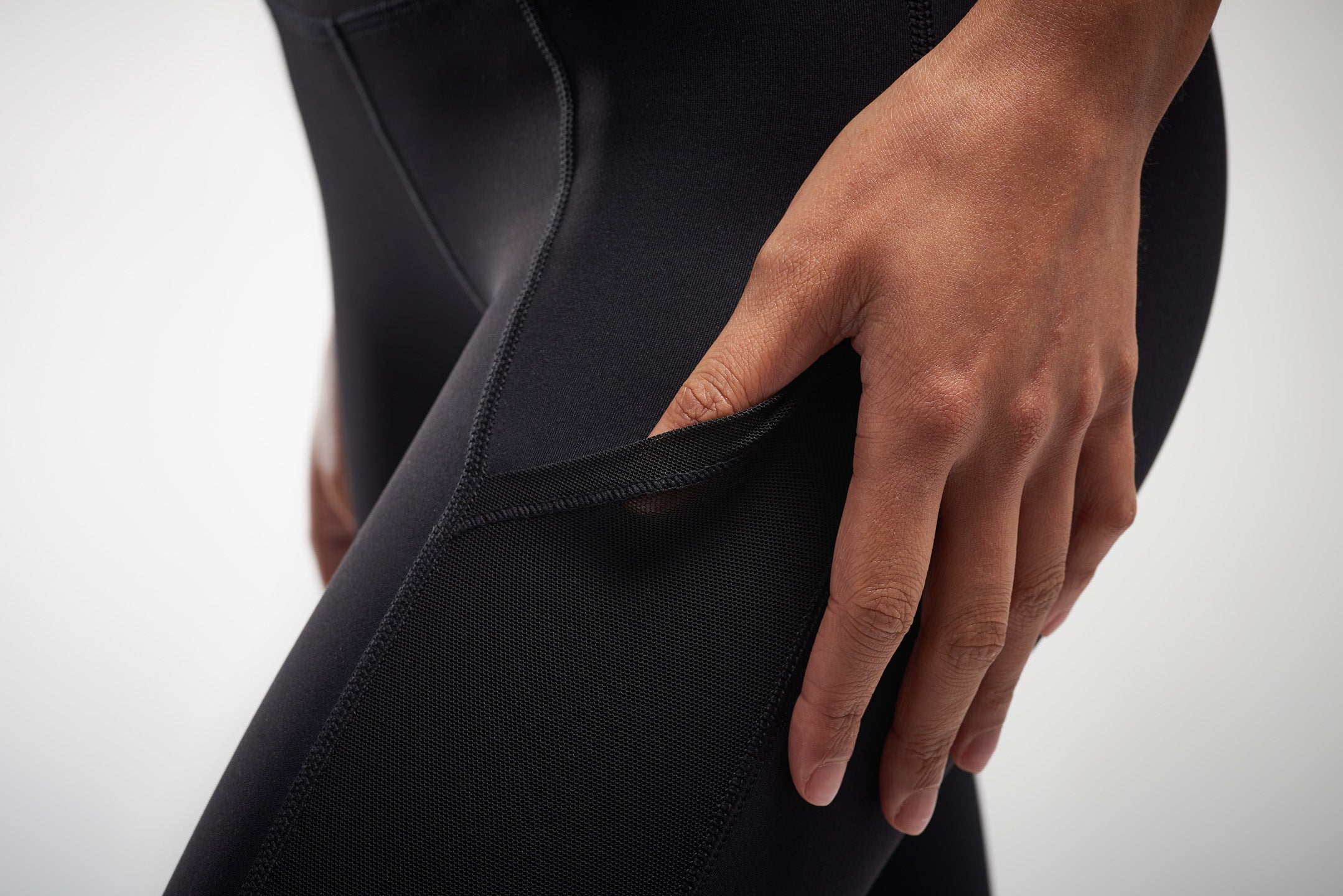 Pocket detail of black mesh leggings